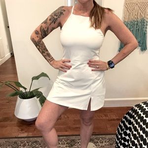 Calia apron neck tennis/golf dress. Soft Jersey material with front thigh slit